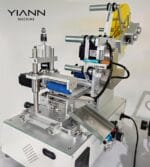 Semi-automatic desktop bouncing PP round tube labeling machine